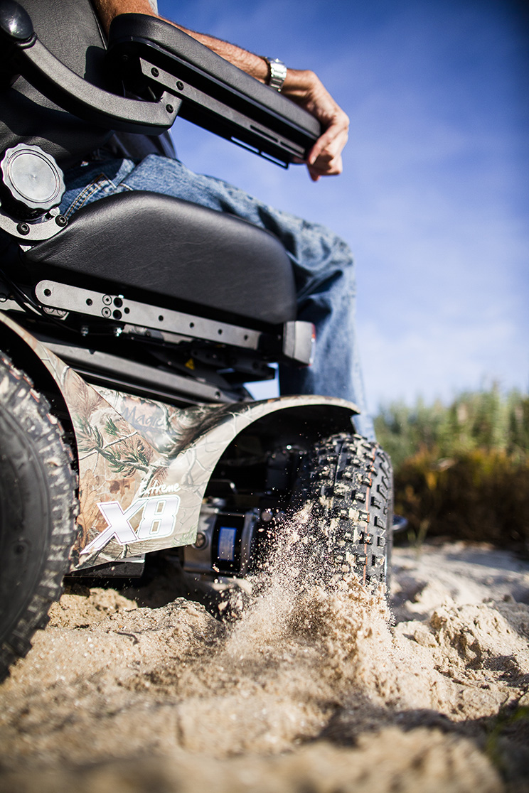 Wheelchair in sand