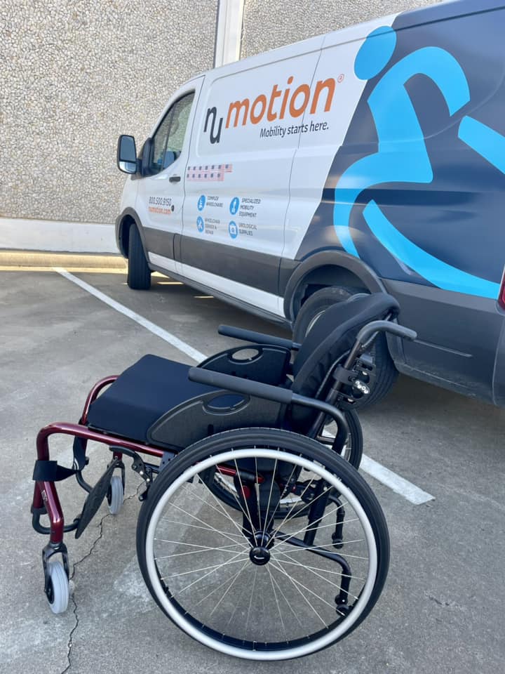 Wheelchair in front of a Numotion van